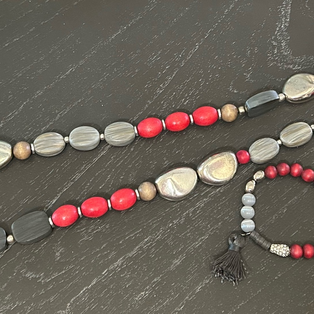 Chico’s long silver grey and red long necklace and bracelet set.